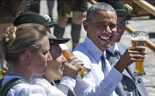Enjoying beer and white sausages surrounded by men in lederhosen, Barack Obama looked perfectly at home as he tucked into a Bavarian breakfast over the weekend. But now the mayor of the picturesque Alpine village of Kruen has revealed that the U.S. president's order was somewhat less traditional than it looked - including a non-alcoholic wheat beer. Eyebrows were raised when, having just stepped off of a night flight from the U.S., Obama was photographed at 11am enjoying half a litre of weissbier - the customary accompaniment to the local hearty breakfast of pretzels and minced veal and bacon sausages. His claim to authenticity took something of a pounding a few hours later, however, when local mayor Thomas Schwarzenberger told reporters that the beer Obama and those accompanying him were served actually contained no alcohol. 